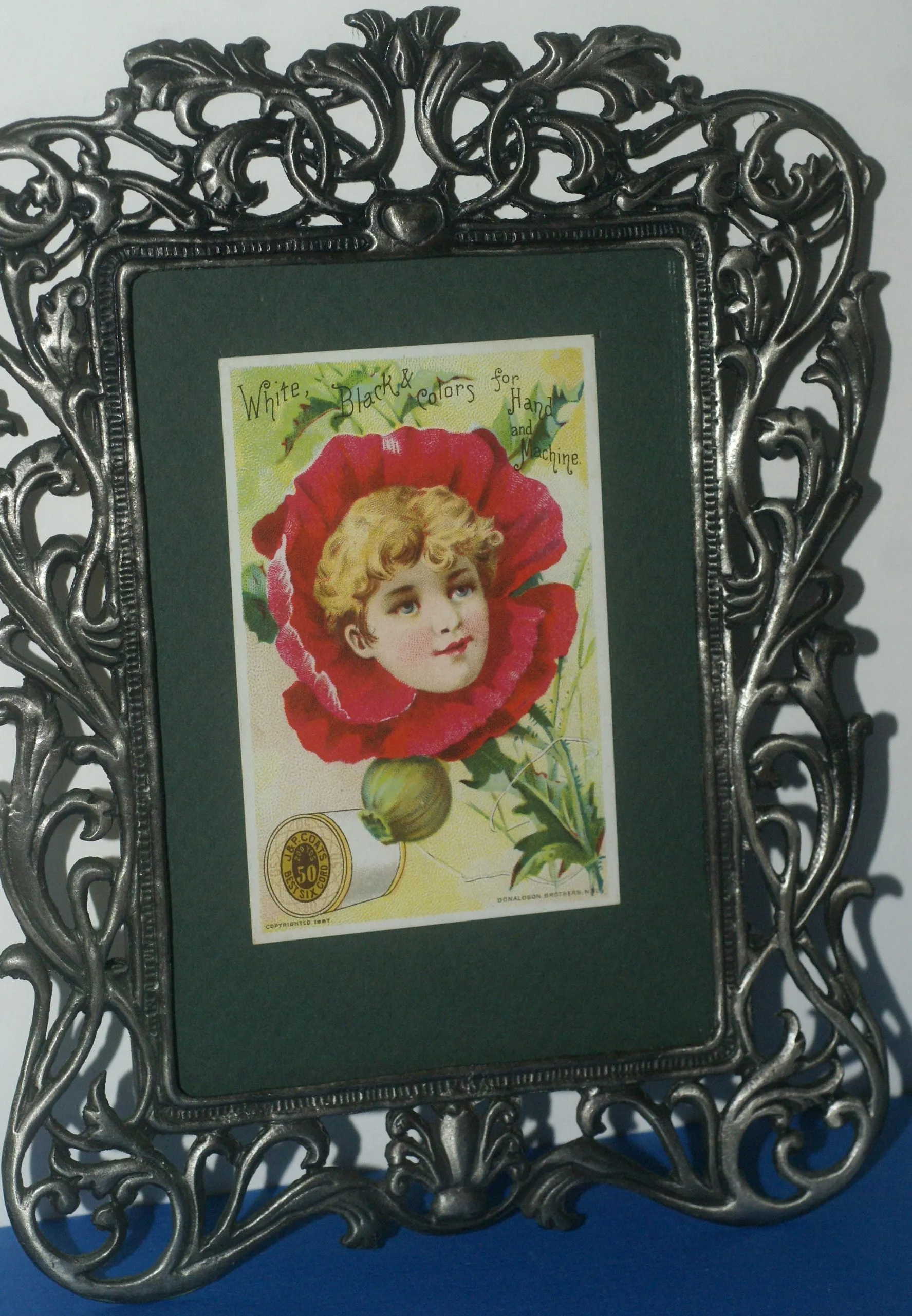 EPHEMERA AMERICANA ANTIQUE WHIMSICAL ART 1887 IN ORNATE FRAME & MATTED, ANTIQUE VICTORIAN ADVERTISING TRADE CARD OF POPPY GIRL: J.& P. Coats (DFPO2J) LACY METAL FRAME 8,5" X 6",5 DESIGNER COLLECTOR COLLECTIBLE WALL DÉCOR